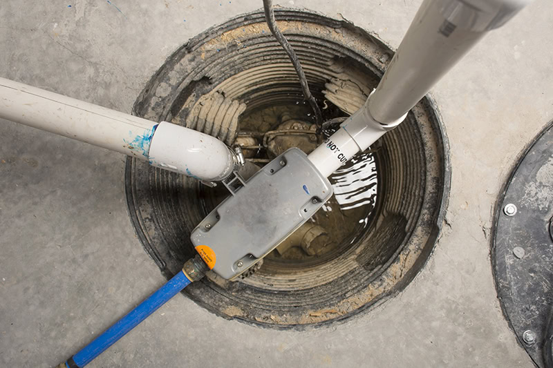 A sump pump installed in a basement of a home.