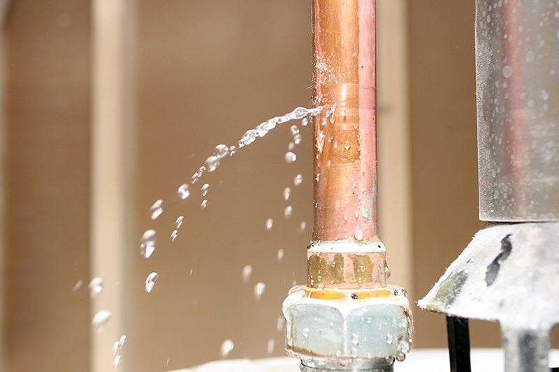 Your Complete Guide to Finding and Fixing Water Leaks. Water leaking from a copper pipe.